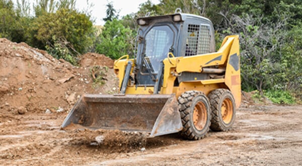 Skid Steer Loader with Bucket Attachment